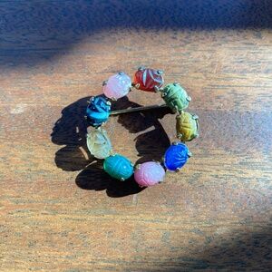 Stone circular brooch